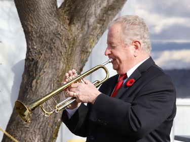 Dick Perras plays the bugle at a Remembrance Day service at Branch 76 of the Royal Canadian Legion in Sudbury, Ont. on Wednesday November 11, 2020. John Lappa/Sudbury Star/Postmedia Network