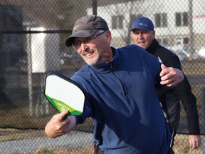 Dick Moss returns the ball during a game of pickleball at O'Connor Park in Sudbury, Ont. on Friday November 20, 2020