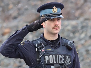 Local Ontario Provincial Police officers gathered at the overpass near Estaire to show their respect for a procession featuring OPP Const. Marc Hovingh's body on Monday November 23, 2020. John Lappa/Sudbury Star/Postmedia Network