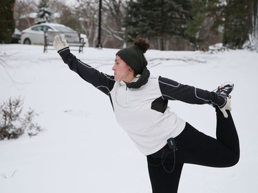 Stephanie Cotnoir cools down with yoga after a run at Bell Park in Sudbury, Ont. on Wednesday November 25, 2020. John Lappa/Sudbury Star/Postmedia Network