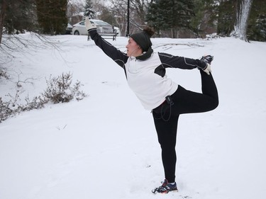 Stephanie Cotnoir cools down with yoga after a run at Bell Park in Sudbury, Ont. on Wednesday November 25, 2020. John Lappa/Sudbury Star/Postmedia Network