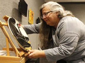 Lise B. L. Goulet, curator of the travelling exhibit named Crossroads, was setting up an art piece by artist Paul Walty at the Timmins Museum on Monday. It is among the pieces being showcased during the museum's new exhibition which runs from Nov. 10 to Dec. 4. 

RICHA BHOSALE/The Daily Press