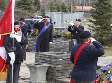 Legion members and those with the Algonquin Regiment stand at attention as a bugler plays at the Timmins Cenotaph during Wednesday's Remembrance Day ceremony. For more Remembrance Day coverage from Timmins, see Page A3

RICHA BHOSALE/The Daily Press