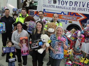 Timmins paramedics display some of the haul they pulled in from the toy drive held in 2018 and donated to North Eastern Ontario Family and Children's Services. Ambulances will be parked in front of Canadian Tire and Walmart for a similar toy drive being held Saturday, Nov. 28.

RON GRECH/THE DAILY PRESS