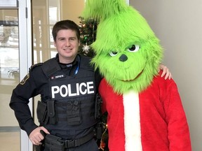 Timmins Police Const. Joseph Depatie is seen here last year posing with the Grinch as part of a promotion for TPS's annual toy drive in collaboration with the Bargain Shop.

Supplied