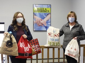 Michelle Lambert, right, executive assistant with Plan 'A' Timmins, and June Woodburn with the Rotary Club of Timmins/Porcupine have partnered up for the second-annual Adopt-A-Senior program which provided Christmas gifts to seniors in long-term care homes who don't have family members.

RICHA BHOSALE/The Daily Press