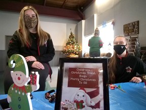 Emily Christiaens (left) and Genevieve Jamieson from Danscene were among the volunteers who helped Saturday at Children Shop for Christmas in Tillsonburg. (Chris Abbott/Norfolk and Tillsonburg News)