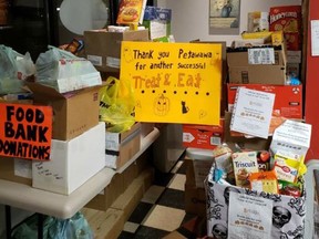 Over 1,500 pounds of donated food items were collected by Petawawa Pantry volunteers as part of the 5th Annual “Treat and Eat” Food Drive on Halloween evening. Submitted photo