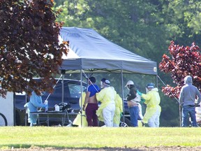 Migrant workers are tested for the COVID-19 virus by a team of medical professionals at ScotLynn Group farm operation in Vittoria in this July file photo. (Derek Ruttan/Postmedia Network)