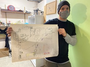 Shawn Bailey, an associate professor at the University of Manitoba's faculty of architecture, showcases a design during a workshop on tiny homes on Monday, Nov. 16.