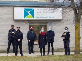 CMHA Grey Bruce have expanded a mobile crisis response partnership that began with the Owen Sound Police Service in 2019. The partnership will now include several police services throughout the region. The Mobile Mental Health and Addiction Response Team works with the police services to  support people experiencing a mental health or addictions crisis.

From left to right: Deputy Chief George Hebblethwaite (Hanover); Chief Robert Martin (West Grey);
Chief Kevin Zettel (Saugeen Shores); Tania Grimer, manager URT/Court Support/Crisis Line/Hanover and Markdale Teams, CMHA Grey Bruce Mental Health and Addiction Services; Clark MacFarlane, Chief Executive Officer, CMHA Grey Bruce Mental Health and Addiction Services. Inspector Krista Miller, Detachment Commander (South Bruce OPP).