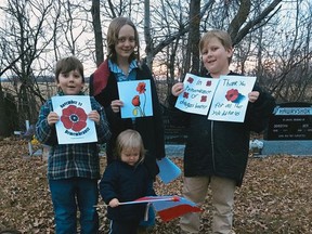 Keira, Soren, Leif and Ari Goodman paid respects to Canada's veterans by placing poppies, a painted stone and pictures on the grave of RCAF LAC Douglas B. Beatty, whose daughter Pat Barton lives in Wetaskiwin and was wishing his memory could be honoured as part of the No Stone Left Alone project.