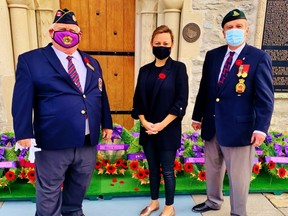 Norfolk Mayor Kristal Chopp, seen here at November’s Remembrance Day observance in Simcoe, praised county staff and residents for making progress on difficult issues in an unprecedented year of challenges arising from the COVID-19 pandemic. At left is Bruce Wilson of the Army, Navy and Air Force (AN&AF) in Simcoe while at right is Canadian armed forces veteran Robin Cooke of Delhi. --  Contributed photo