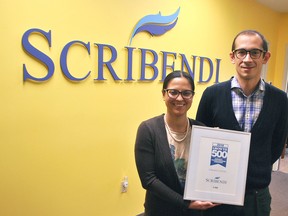 Scribendi president Patricia Riopel and CEO Enrico Magnani hold up their award for making the Growth 500 Canada's Fastest Growing Companies list in Canadian Business magazine at their Chatham office in 2018. The company has also been named by Great Places to Work as one of the best workplaces in Canada managed by women in 2020. (Tom Morrison/Chatham This Week)