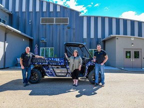 Stojan’s owners Rene Remillard (left) and Jerry Stojan (right) hand over the keys of a new 2020 Can-Am Defender PRO to PARDS executive director Jennifer Douglas (centre) at PARDS Therapeutic Centre south of Grande Prairie, Alta. on Tuesday, July 14, 2020. SUBMITTED