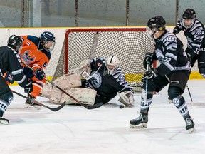 Photo courtesy NOJHL

Soo Thunderbirds forward Caleb Wood (second from left) hunts down a rebound in front of Espanola netminder Owen Willis in NOJHL action on Thursday at John Rhodes Community Centre
