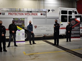 The Beaumont Fire Service presented the Edmonton Firefighter Burn Treatment Society with a cheque for $9,000 at the Beaumont Fire Hall on Dec. 1. Beaumont Fire Service raised funds through sales of the Beaumont Fire cookbook, in keeping with this year's theme of fire safety in the kitchen.
(Emily Jansen)
