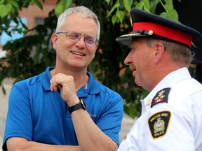 Dr. Alan McLean and Sault Ste. Marie Police Service Chief Hugh Stevenson speak during Neighbourhood Resource Centre's fifth anniversary in Sault Ste. Marie, Ont., on Wednesday, July 10, 2019. (BRIAN KELLY/THE SAULT STAR/POSTMEDIA NETWORK)