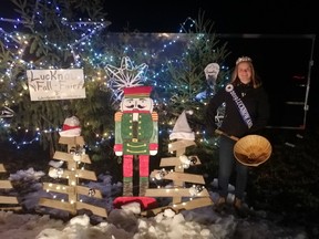 Megan Metske, Lucknow's Fall Fair Ambassador, was busy handing out candy at the drive-by Santa Claus Parade in Lucknow on Friday, November 27. Hannah MacLeod/Lucknow Sentinel