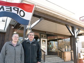 Joyce and John Weaver, owners of the Kent Bridge Country Market, pose for a photo outside of the store Dec. 2, 2020. (Tom Morrison/Chatham This Week)