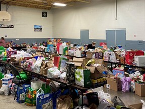 Volunteers sort toys collected during The Gift event, which was held throughout Chatham-Kent, at the Scout Hut in Ridgetown. On select dates, residents and need will be able to visit the Scout Hut to pick up toys or food. (Handout/Postmedia Network)