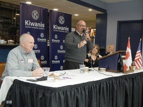 Sarnia-Lambton Crime Stoppers president Sean Robbins (speaking on the microphone) and program co-ordinator Tim Brown (left, seated) speaks to the Seaway Kiwanis Club about the non-profit organization and its role in the community. Carl Hnatyshyn/Sarnia This Week