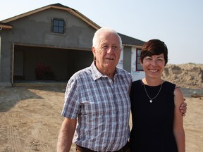 Owen Byers, chairperson of the Charlotte Eleanor Englehart Hospital Foundation, and Kathy Alexander, executive director of the Bluewater Health Foundation, are pictured posing in July 2019 outside one of last year's dream home grand prizes as its being built in Sarnia. Lottery tickets for the 2021 dream home being built in Petrolia went on sale Dec. 1. File photo/Postmedia Network