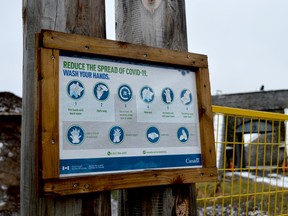 A sign at Fort Wellington National Historic Site in Prescott reminds people of some of the precautions they must take to stop the spread of COVID-19. (TIM RUHNKE/The Recorder and Times)