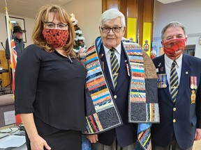Bob Handspiker (centre), honours and awards chairman for the Pembroke Legion, was surprised during the annual awards ceremony Nov. 29 at the branch with the presentation of a Quilt of Valour. Making the presentation were his daughter Nicole Handspiker Adams and Branch 72 president Stan Halliday.