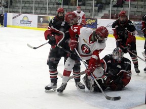 Kenora Thistles forward Cael Anderson digs for a puck against the Southwest Cougars in Manitoba U18 AAA Hockey League action last season. The Thistles will be playing in the Superior International Junior Hockey League this season amid the COVID-19 pandemic.