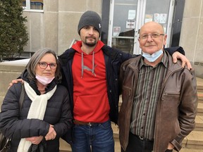 Matthew Saroka, centre, is flanked by his parents Halina and Sam, following the conclusion of the sentencing hearing of Paul St. Amour Wednesday afternoon at the Sudbury Courthouse. PHOTO BY HAROLD CARMICHAEL/ SUDBURY STAR
