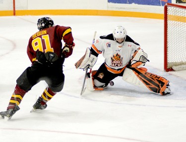 Hearst Lumberjacks goalie Liam Oxner prepares to smoother the puck before Timmins Rock Captain Derek Seguin can pounce on his rebound during the second period of Sunday afternoon’s NOJHL game at the McIntyre Arena. While Seguin was foiled on this play, he did net a first-period shorthanded goal to help lead the Rock to a 2-1 victory. The two sides will meet again at the McIntyre Arena on Tuesday, at 8:30 p.m. THOMAS PERRY/THE DAILY PRESS
