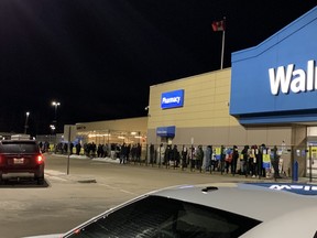 People are seen lined up outside of the North Bay Walmart, early Saturday morning. The store reopened at 7 a.m. after being closed for three weeks due to a fire. Supplied Photo