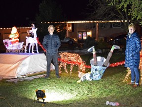 The Mills family decorated the front lawn of their Whalen Line home in Centralia with a “Grandma Got Run Over by a Reindeer” theme. Pictured are Kurt and Judy Mills. Dan Rolph