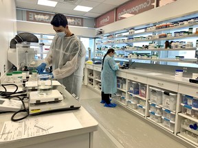 Rebecca Rainey, a registered pharmacy technician at Algonquin Pharmasave, and pharmacy student Greg Hill work in a newly created compounding lab, Tuesday. The lab creates pills and creams that can’t be purchased off the shelf. Jennifer Hamilton-McCharles/The Nugget