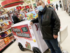 Grande Pointe’s Robert Carriere of Carriere Innovations shows his replica of an ice resurfacing machine. It’s being used at the Chatham-Kent Home Hardware Building Centre to promote the Chatham Goodfellows’ No Child Without a Christmas Campaign. Mark Malone/Postmedia Network