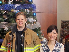 Point Edward firefighter Chris Reddy (left) is leading a holiday toy drive for young patients at Bluewater Health. He’s with Kathy Alexander, the executive director of Bluewater Health Foundation, in this file photograph from 2019. File photo/Postmedia Network