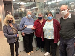 Sussan Londry (left), president of the Wallaceburg Rotary Club, hands a cheque for $10,000 to the Wallaceburg and District Museum members Elaine Gatt, museum president, Dee Gallerno, treasurer, Louise Benn, secretary and Rotary member Herman Geithoorn. The money will help the museum install buttons that, when pushed, describe what the exhibits are about. Jake Romphf/Courier Press