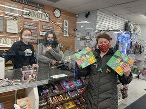 Finchers employees Louisa Matheson and Stacy MacGregor receive copies of "Meet Will and Jake" from Jenny Raspberry. SUBMITTED