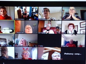 Jean MacDonald (first square on left, second row) plays piano while members of the South Bruce branch of the Retired Women Teachers of Ontario/Organization des Enseignantes Retraitées de l’Ontario sing Christmas carols. Christine Roberts photo