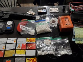 Police arrested four people and seized cocaine, fentanyl and methamphetamine along with a replica firearm, currency and other items generally associated with drug trafficking after executing a search warrant at a location on Barrett Chute Road. OPP photo