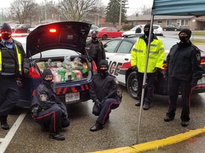 The Woodstock Police Service filed 12 cruisers with donations for the Salvation Army during their annual Fill a Cruiser event on Saturday. (Woodstock Police Service)