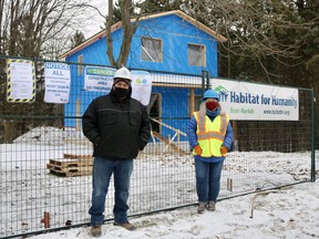 Joe Scrocco, build services director, and Lynda Henriksen, director of fund development and communications, stand outside of the Brook Street, Simcoe, Habitat for Humanity build on Thursday afternoon. (ASHLEY TAYLOR/SIMCOE REFORMER)