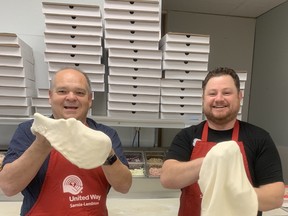 Chris Skillas of Christo’s Pizza gives Dave Brown, of the United Way of Sarnia-Lambton a crash course on the art of pizza creation. Christo’s sold pizza kits so families can make pizzas at home with $5 from each sale being donated to the United Way from Christo’s. Those who have ordered their pizza kits are reminded to pick them up Monday or Tuesday. Christo’s hopes to have sold 300 kits. United Way photo