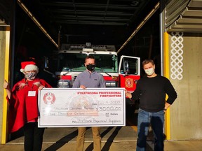 Strathcona County Professional Firefighters donated $3,000 to the Strathcona Christmas Bureau on Dec. 3. Overall, the 44th annual campaign collected more than $120,000 and supported almost 1,400 residents. Photo via Facebook