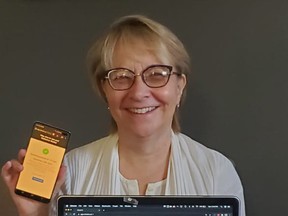 Software company IndustrialWebApps has developed a COVID-19 screening application called Check'N. Company president Katherine Walker poses with screenshots of the app. (Submitted)