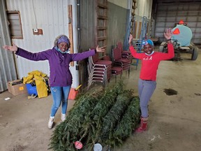 Fifteen trees were donated to the farmworkers at Schuyler Farms in Norfolk County. Shelly Ragoo and Sherine King, along with around 200 other migrant workers, will be spending their Christmas season in southern Ontario as a result of travel restrictions. (CONTRIBUTED PHOTO)