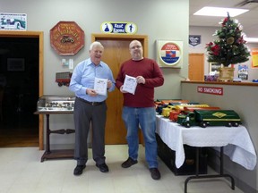 Rotarian Ken McGee (left) and his employee and packaging expert Josh Middelkamp, at Ken’s shop. They sent two of the Rotary fundraiser puzzles to the two Canadian Michaels imprisoned in China.
Rotary supplied the puzzles and Ken donated the postings. Submitted