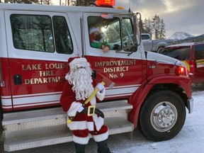 On Saturday Dec.19 Lake Louise RCMP and LLFD members escorted Santa on a drive-through Lake Louise to spread smiles, joy and happiness. Lake Louise Fire Department Facebook photo.