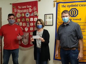 Jeff Goulding and Glenn Lang, Co-Chairs of the Walkerton Kinsmen Raffle Draw and Novelty Casino presenting a cheque to Walkerton & District Optimist Club President Connie Weber. Steven Travale photo